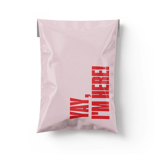Pink shipping poly mailer for small business or resellers with red text 'YAY, I'M HERE!' on a pink background