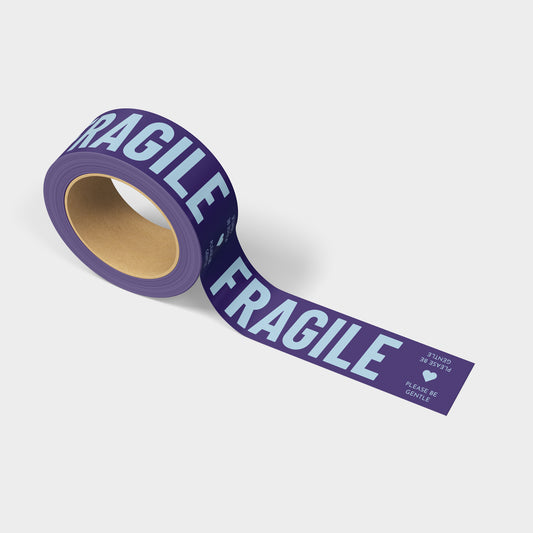 A roll of printed shipping tape with the words Fragile in fun purple colors.