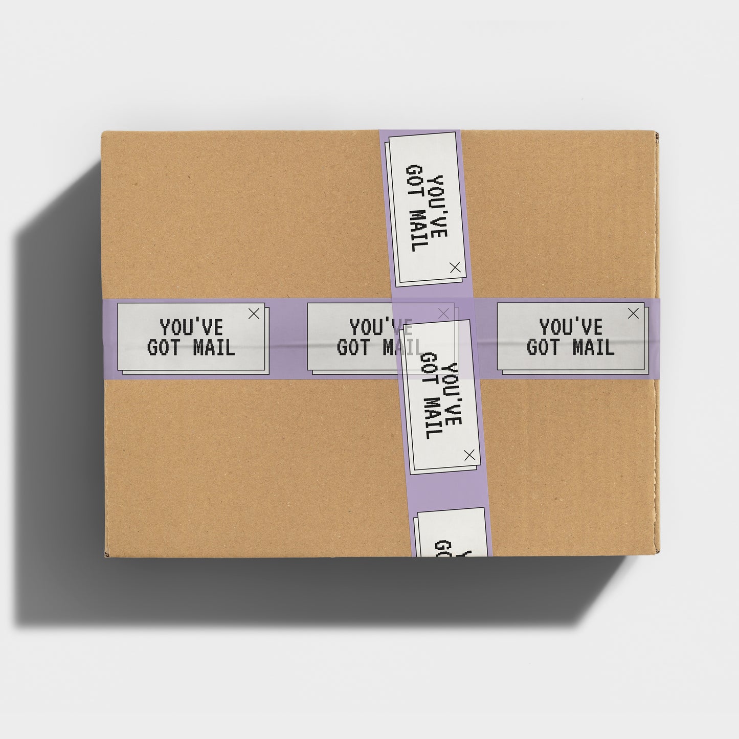 A box sealed with purple and white packing tape with Meg Ryan movie quote "You've Got Mail" printed on it.