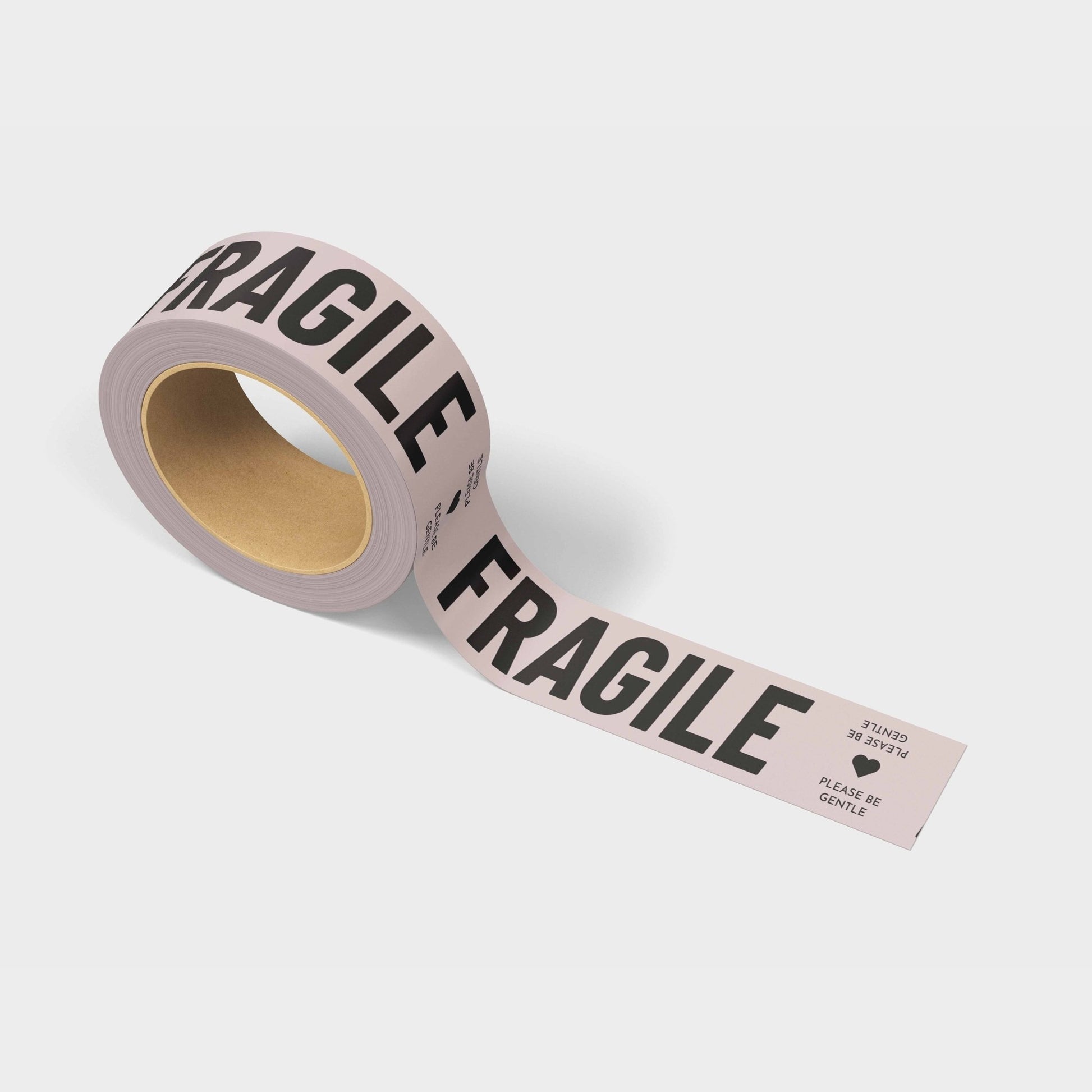 A roll of printed shipping tape with the words Fragile, Please Be Gentle on it.