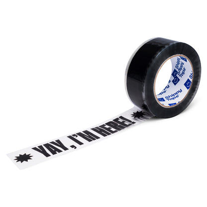 A roll of clear packing tape with the words Yay I'm Here printed in black font.